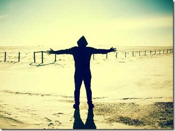 outstretched hands on beach